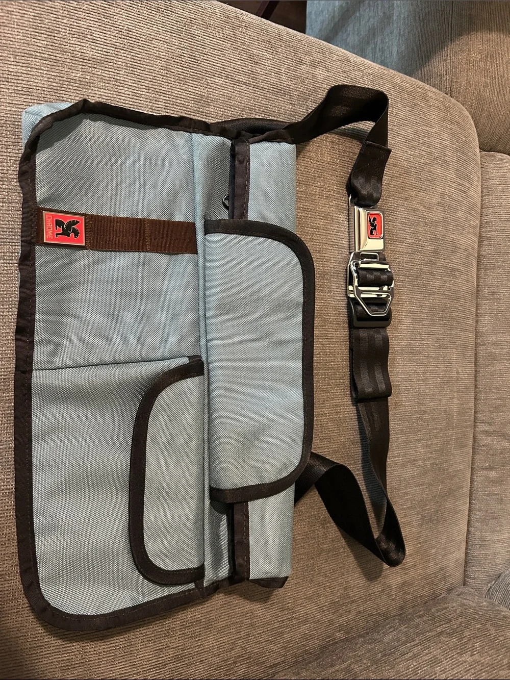 Light Blue Messenger Bag with Black Trim and Adjustable Strap